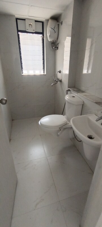 Bathroom in 2 BHK Apartment at Runwal Gardens, Dombivli East – for Rent