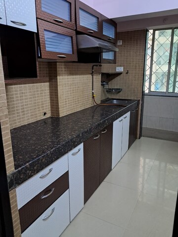 Kitchen in 2 BHK Apartment at Kamanwala Manavstal, Malad West – for Rent
