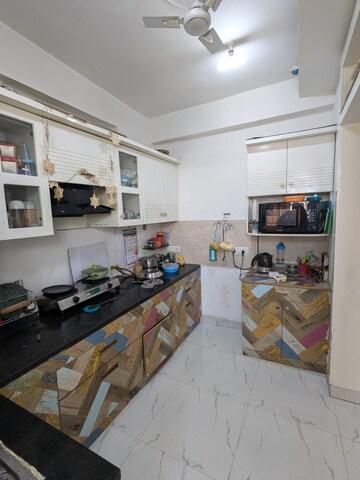 Kitchen in 3 BHK Apartment at Casa Woodstock, Sector 16c Greater Noida – for Sale