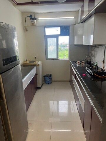 Kitchen in 2 BHK Apartment at K Raheja Palm Court, Malad West – for Rent