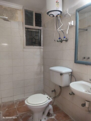 Bathroom in 2 BHK Apartment at CGHS HEWO Apartments, Sector 56 – for Rent