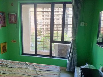 Bedroom in 2 BHK Apartment at Divya Stuti CHS, Goregaon East – for Sale