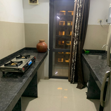 Kitchen in 1.5 BHK Apartment at Lodha Lakeshore Greens, Hedutane – for Rent
