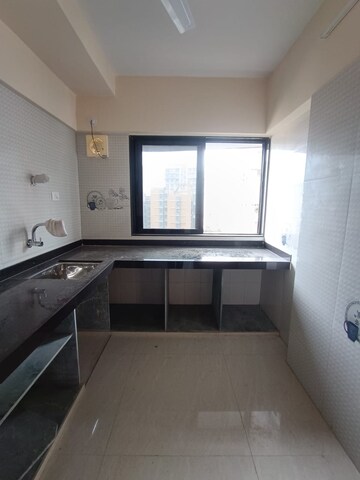 Kitchen in 3 BHK Apartment at Lashkaria Green Woods, Andheri West – for Sale