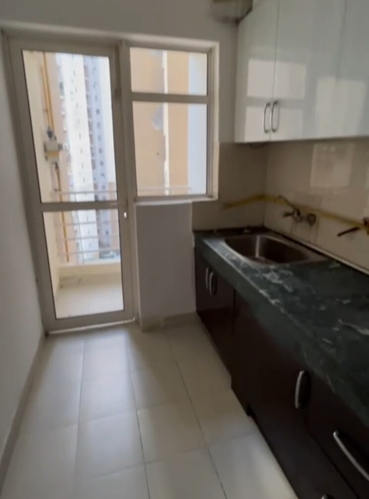 Kitchen, paras-tierea 2 Bedroom 1045 Sq.Ft. Apartment In Sector 137 Noida 8031143