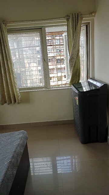 Living Room in 2 BHK Apartment at Crystal Isle Apartment, Goregaon East – for Sale