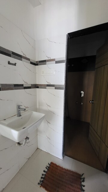 Bathroom in 1 BHK Apartment at Dynamic Crest, Shilphata – for Rent