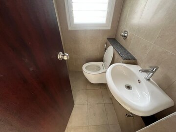 Bathroom in 3 BHK Apartment at Puravankara Silversands, Mundhwa – for Rent