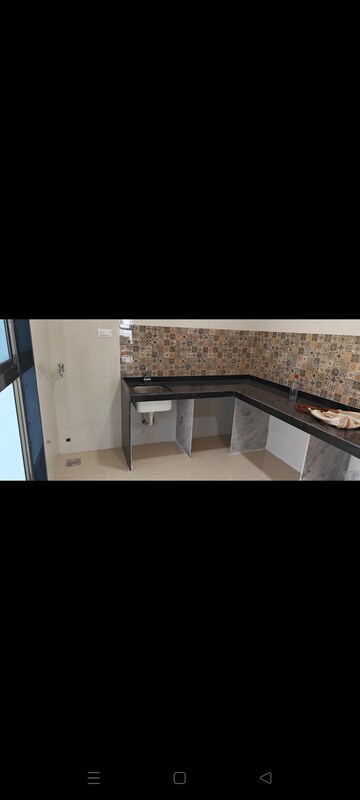 Kitchen in 4 BHK Apartment at Rajesh Raj Infinia, Malad West – for Rent