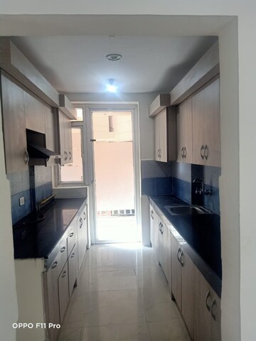 Kitchen in 3 BHK Apartment at Mahagun Moderne, Sector 78 – for Rent