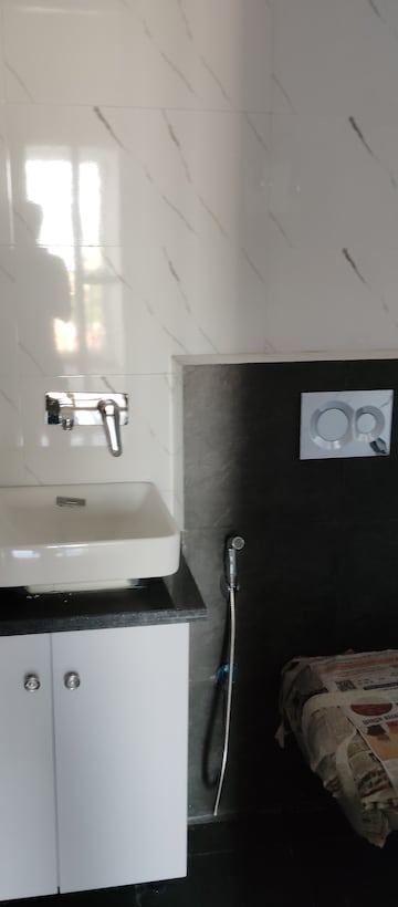 Bathroom in 3 BHK Apartment at Paradigm Business Hermitage Park, Dhakoli Village – for Rent