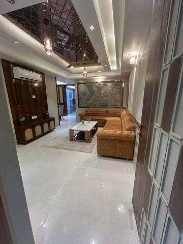 Living Room in 4 BHK Apartment at Mansarovar Extension – for Sale