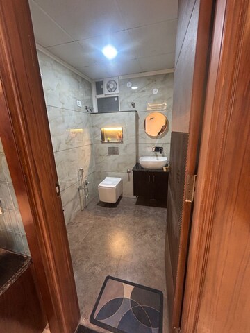 Bathroom in 4 BHK Apartment at Mansarovar Extension – for Sale