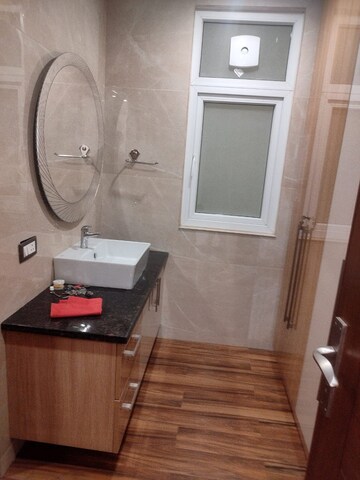 Bathroom in 4 BHK Builder Floor at DLF Plaza Tower, Sector 26a – for Rent