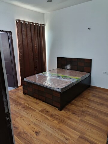Bedroom in 2 BHK Apartment at Sikka Karnam Greens, Sector 143b – for Rent