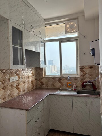 Kitchen in 3 BHK Apartment at Amrapali Riverview, Amrapali Leisure Valley – for Rent