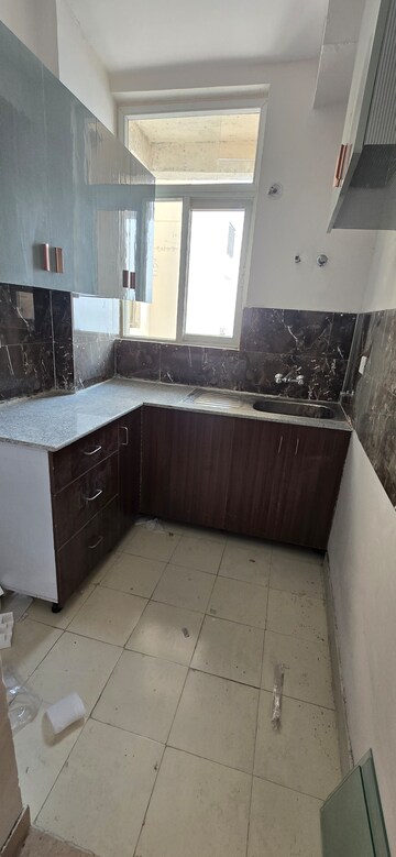 Kitchen in 2 BHK Apartment at Amrapali Riverview, Amrapali Leisure Valley – for Rent