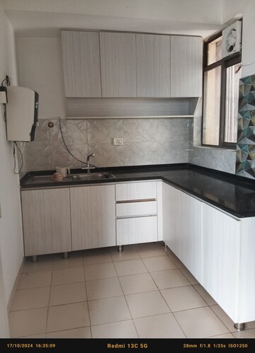 Kitchen in 2 BHK Apartment at Unitech Uniworld Gardens 2, Sector 47 – for Rent