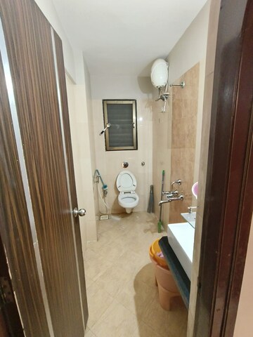 Bathroom in 2 BHK Apartment at Sudarshan Sky Garden, Ghodbunder Road – for Rent
