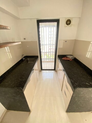 Kitchen in 1.5 BHK Apartment at Lodha Palava City Lakeshore Greens, Dombivli East – for Sale