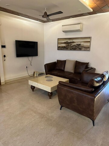 Living Room in 4 BHK Builder Floor at DLF Square, Sector 25 – for Rent