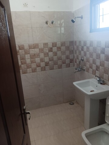 Bathroom in 3 BHK Apartment at Ansal API Victoria Floors, Dhakoli Village – for Rent