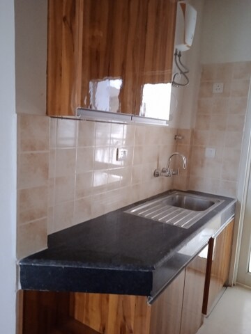 Kitchen in 4 BHK Apartment at Ramprastha Awho, Sector 95 – for Sale