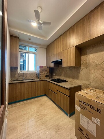 Kitchen in 2 BHK Apartment at Ambience Creacions, Sector 22 – for Rent