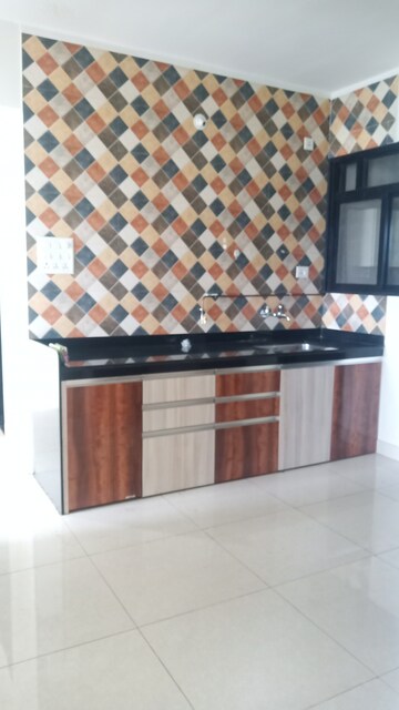 Kitchen in 2.5 BHK Apartment at Sargam CHS Nanded, Sinhagad Road – for Rent