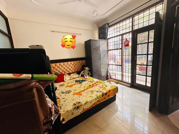 Bedroom in 2 BHK Builder Floor at Guru Nanak Enclave, Dhakoli Village – for Rent