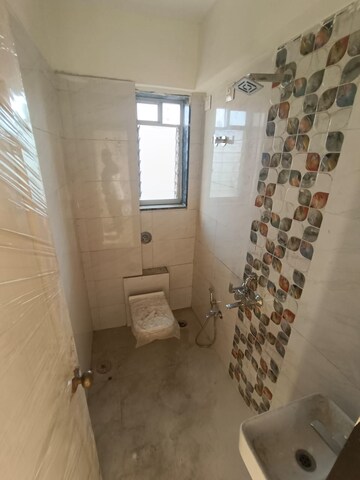 Bathroom in 2 BHK Apartment at Romell Asrava, Andheri West – for Sale