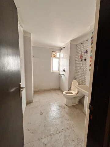 Bathroom in 4 BHK Apartment at Gulshan Vivante, Sector 137 – for Sale