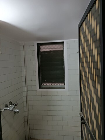 Bathroom in 1 BHK Apartment at Himgiri Lokupvan Phase II CHS Ltd, Vasant Vihar – for Rent
