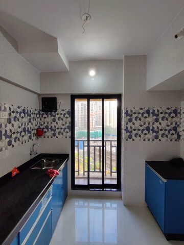 Kitchen in 1 BHK Apartment at Raunak Unnathi Woods Phase 6, Ghodbunder Road – for Rent
