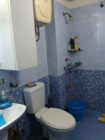 Bathroom in 2 BHK Apartment at Aims Golf City, Sector 75 – for Sale