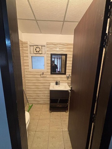 Bathroom in 2 BHK Apartment at Elite Golf Green, Sector 79 – for Rent