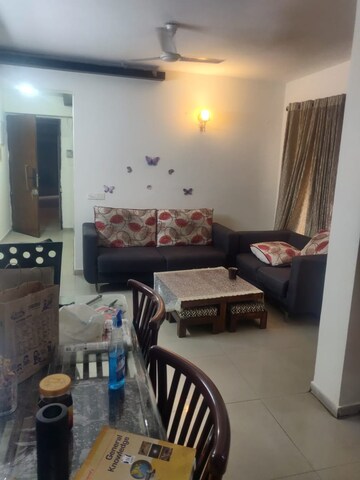 Living Room in 2 BHK Apartment at Amrapali Golf Homes, Sector 4, Greater Noida – for Sale