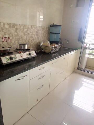 Kitchen in 1 BHK Apartment at Om Shree Sai Woodside Meadows, Kalyan West – for Sale