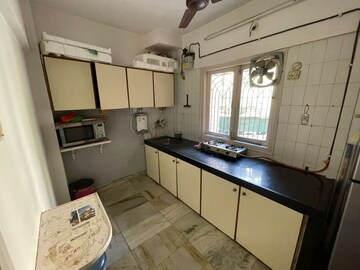Kitchen in 3 BHK Apartment at Juhu Abhishek Chs Ltd, Andheri West – for Sale