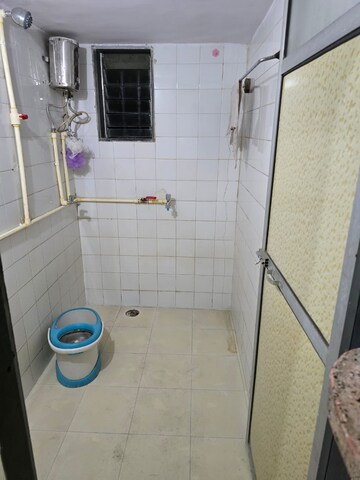 Bathroom in 1.5 BHK Apartment at Naupada – for Rent
