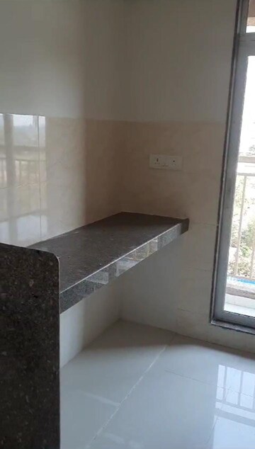 Kitchen in 1.5 BHK Apartment at Metropolis Aquaris Phase 1, Kasarvadavali – for Sale