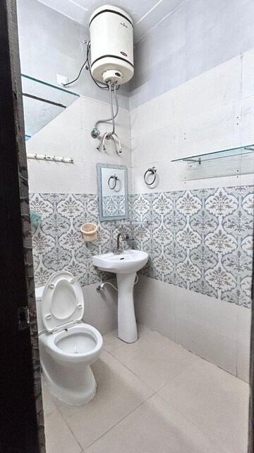 Bathroom in 2 BHK Apartment at Guru Nanak Enclave, Dhakoli Village – for Rent