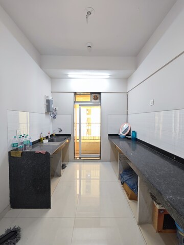 Kitchen in 2 BHK Apartment at Rustomjee Urbania, Majiwada – for Rent