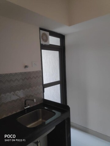 Kitchen in 2 BHK Apartment at Lodha Quality Home Tower 2, Majiwada – for Rent