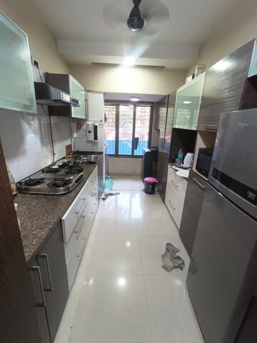 Kitchen in 2 BHK Apartment at Goyal Green Woods, Andheri East – for Rent