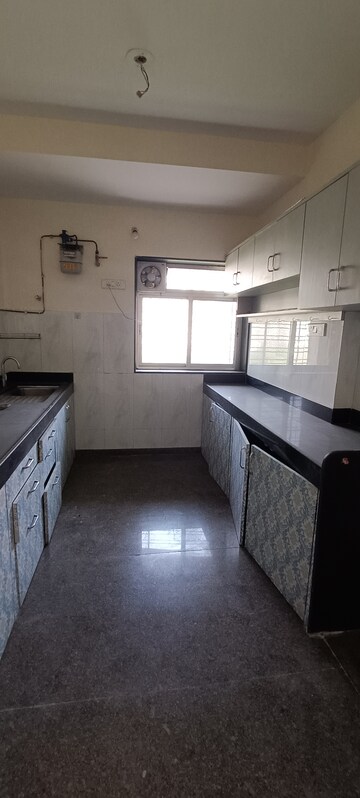 Kitchen in 3 BHK Apartment at Kalpataru Hills Phase II, Manpada – for Rent