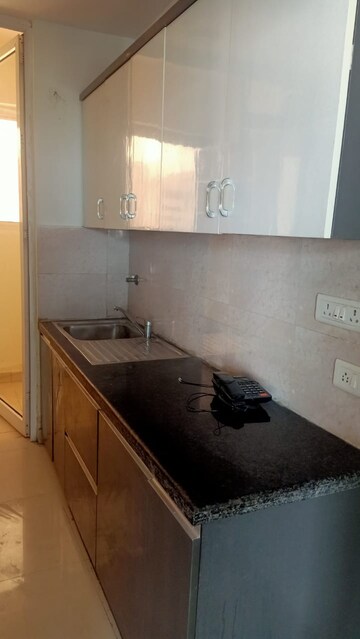 Kitchen in 3 BHK Apartment at Mahagun Mirabella, Sector 79 – for Sale