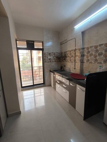 Kitchen in 2 BHK Apartment at Jeenaam Adiraj Ascent , Nalasopara East – for Rent