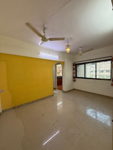 Living Room in 1 BHK Apartment at Raj Shivam Society, Dahisar East – for Rent
