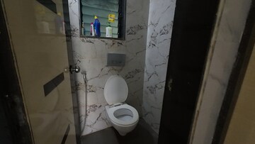 Bathroom in 1 BHK Apartment at RNA NG Canary, Mira Road – for Sale